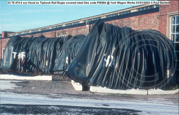 33 70 474 6 xxx Hood ex Tiphook Rail Bogie covered steel Des code PIE684 @ York Wagon Works 2002-01-01 © Paul Bartlett [2w]